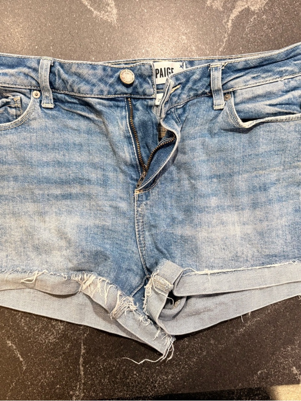 PAIGE Washed Light Blue Denim Cutoff Shorts